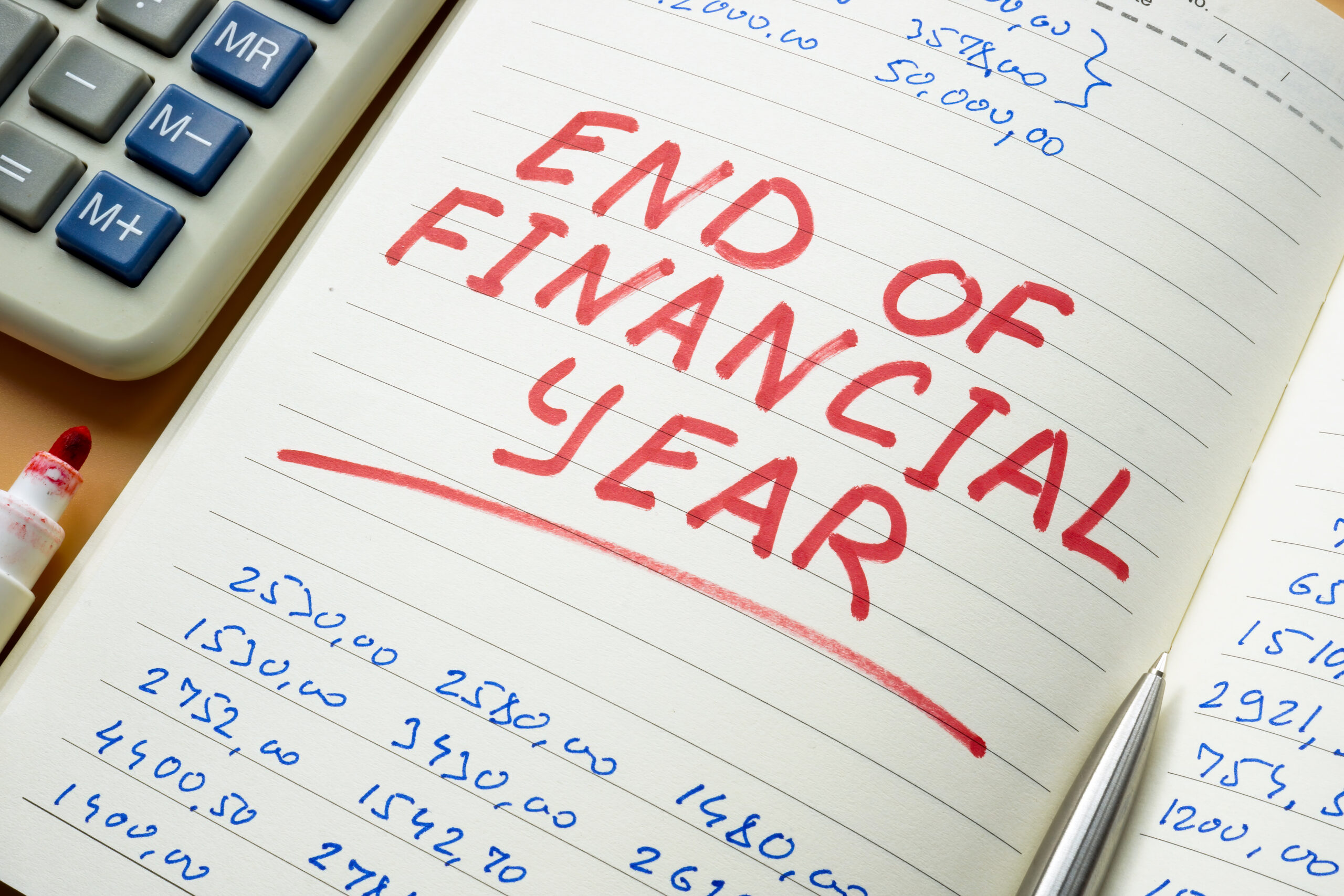 End of financial year mark in the ledger.